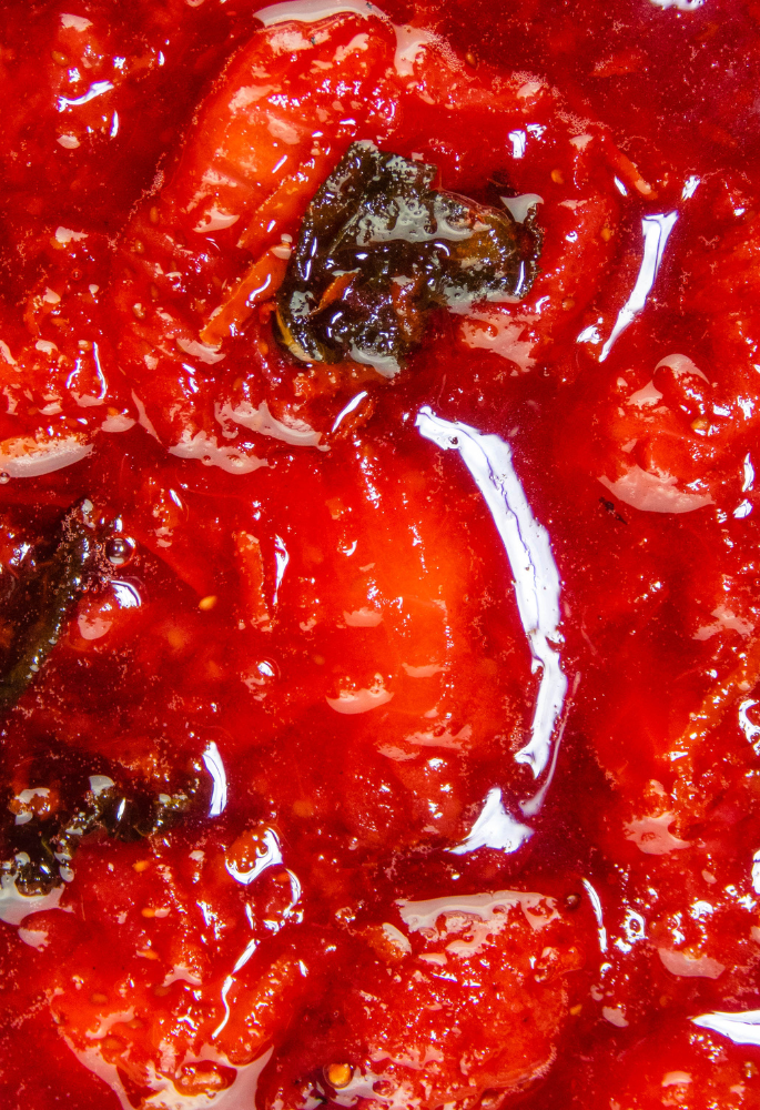 Close up of thick, sticky and chunky strawberry sauce